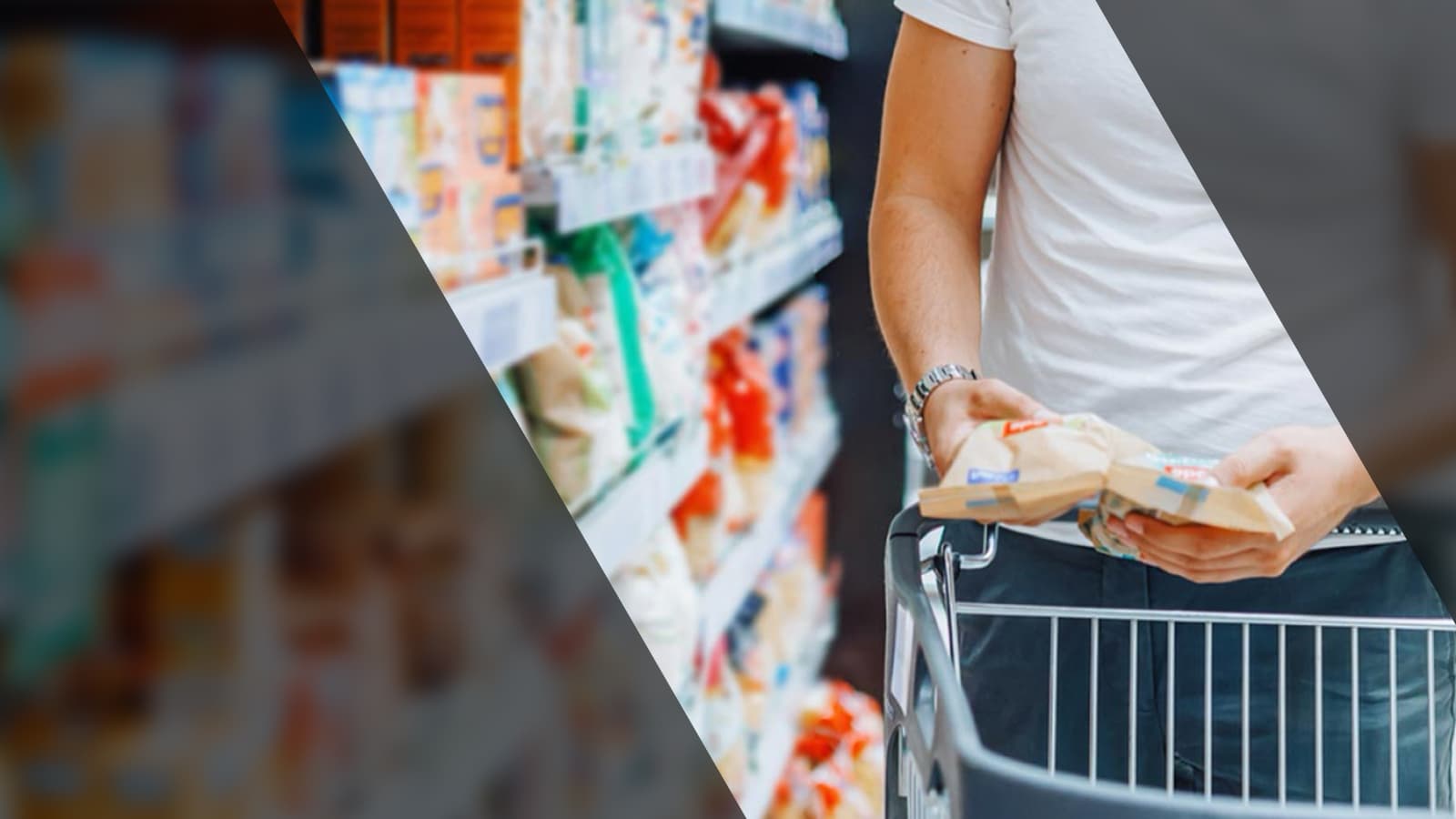 A man pushes a cart filled with various food items in a bustling market setting.